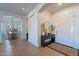 Inviting foyer with light hardwood flooring and neutral decor, creating a welcoming entrance at 3706 E Ravenswood Dr, Gilbert, AZ 85298