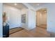 Bright entryway with hardwood floors, white walls, and modern decor at 3706 E Ravenswood Dr, Gilbert, AZ 85298