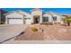 Beautiful single-story home featuring a three-car garage, landscaped yard and a charming entry gate at 3706 E Ravenswood Dr, Gilbert, AZ 85298