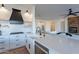 Open-concept kitchen with white cabinets, modern appliances, and large island perfect for entertaining at 3706 E Ravenswood Dr, Gilbert, AZ 85298