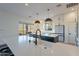 Spacious kitchen with quartz countertops, large island with seating, and stainless steel appliances at 3706 E Ravenswood Dr, Gilbert, AZ 85298