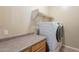 Bright laundry room with modern washer and dryer, built-in cabinets, and ample counter space at 3706 E Ravenswood Dr, Gilbert, AZ 85298