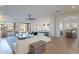 Open-concept living area with a large sectional couch, flowing seamlessly into the kitchen and dining area at 3706 E Ravenswood Dr, Gilbert, AZ 85298