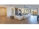 Spacious living room with hardwood floors, stone fireplace, and built-in shelves at 3706 E Ravenswood Dr, Gilbert, AZ 85298
