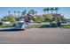 Well-maintained parking area with ample spaces and landscaping near community buildings at 3706 E Ravenswood Dr, Gilbert, AZ 85298