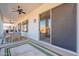 Spacious covered patio for outdoor dining, features a ceiling fan and seamless access to indoor living spaces at 3706 E Ravenswood Dr, Gilbert, AZ 85298