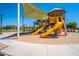 A colorful community playground with slides, climbing structures, and a shaded area for year-round fun at 3706 E Ravenswood Dr, Gilbert, AZ 85298