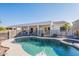 Beautiful backyard pool featuring a built-in spa and covered patio is perfect for outdoor living and entertaining at 3706 E Ravenswood Dr, Gilbert, AZ 85298