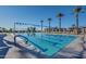 Resort-style swimming pool with lap lanes, lounge chairs, and shaded seating areas at 3706 E Ravenswood Dr, Gilbert, AZ 85298