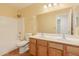 Bathroom featuring a double sink vanity, large mirror, and shower-tub combo at 37379 W Amalfi Ave, Maricopa, AZ 85138