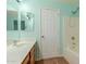 Bathroom featuring vanity, mirror, and shower-tub combination at 37379 W Amalfi Ave, Maricopa, AZ 85138