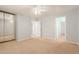 Light bedroom showcasing carpet, open door, and mirrored closet at 37379 W Amalfi Ave, Maricopa, AZ 85138