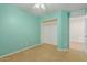 Bedroom showcasing spacious closet, carpet, and ceiling fan at 37379 W Amalfi Ave, Maricopa, AZ 85138
