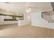 Spacious living room showcasing wood floors, an open layout, and seamless transitions to other areas at 37379 W Amalfi Ave, Maricopa, AZ 85138