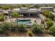 Aerial view of a house featuring a pool and a large covered patio at 38820 N 10Th St, Phoenix, AZ 85086