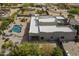 Aerial view of a Southwestern style home with a pool, located in a desert landscape at 38820 N 10Th St, Phoenix, AZ 85086