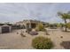 Backyard featuring desert landscaping and pool with covered patio and surrounding vegetation at 38820 N 10Th St, Phoenix, AZ 85086