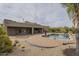 Backyard featuring pool with cacti and desert landscaping, and covered patio at 38820 N 10Th St, Phoenix, AZ 85086
