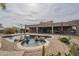 Backyard featuring pool and spa with covered patio, cacti and desert landscaping at 38820 N 10Th St, Phoenix, AZ 85086