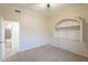 This bedroom has light colored walls, carpet and an ensuite bathroom at 38820 N 10Th St, Phoenix, AZ 85086