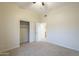 This bedroom has light colored walls, carpet and a closet with sliding doors at 38820 N 10Th St, Phoenix, AZ 85086