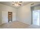 This bedroom has light colored walls, carpet, and a closet with sliding doors at 38820 N 10Th St, Phoenix, AZ 85086