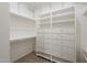 Walk-in closet featuring shelves and drawers for ample storage at 38820 N 10Th St, Phoenix, AZ 85086