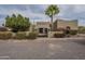Elegant front entrance with black wrought iron gate and lush landscaping at 38820 N 10Th St, Phoenix, AZ 85086