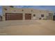 Spacious three-car garage with solid wood doors and wide driveway provides ample parking at 38820 N 10Th St, Phoenix, AZ 85086