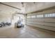 Spacious two car garage with an open garage door, a motorcycle and plenty of room for storage at 38820 N 10Th St, Phoenix, AZ 85086