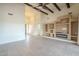 Open living room boasting beamed ceilings, built-in media center, and seamless flow to other living spaces at 38820 N 10Th St, Phoenix, AZ 85086