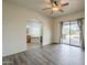 Open living space with wood floors, an arched entry, and patio doors leading to the back at 38820 N 10Th St, Phoenix, AZ 85086