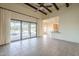 Expansive open floorplan featuring a dining area, a kitchen, and living area with patio access and pool views at 38820 N 10Th St, Phoenix, AZ 85086