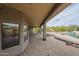 Covered patio featuring outdoor kitchen and view of the backyard and swimming pool at 38820 N 10Th St, Phoenix, AZ 85086