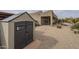 Backyard with shed, desert landscaping and covered patio at 38820 N 10Th St, Phoenix, AZ 85086