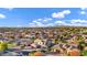 Wide angle neighborhood shot of mature landscaping, a stunning sunset sky, and many beautiful single-Gathering homes at 3930 E Enrose St, Mesa, AZ 85205