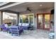 Back patio featuring ceiling fan, seating and a fireplace with an entrance to the house at 3930 E Enrose St, Mesa, AZ 85205