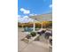 Inviting backyard featuring a pool, spa, and pergola with a built-in table, perfect for outdoor gatherings at 3930 E Enrose St, Mesa, AZ 85205