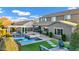 Inviting backyard featuring a pool, spa, pergola, and lush landscaping at 3930 E Enrose St, Mesa, AZ 85205