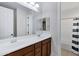 Bathroom with double sink vanity with stainless steel fixtures, and a shower-tub combo at 3930 E Enrose St, Mesa, AZ 85205