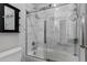 Bathroom with gray and white tile backsplash and a glass shower door at 3930 E Enrose St, Mesa, AZ 85205