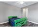 Cozy bedroom featuring wood floors, light gray walls, and an open door at 3930 E Enrose St, Mesa, AZ 85205