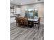 Large dining room with a wooden table, seating for eight, and a window view of the backyard pool at 3930 E Enrose St, Mesa, AZ 85205