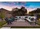 Cozy outdoor fire pit with comfortable seating and lush greenery at 3930 E Enrose St, Mesa, AZ 85205