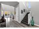 Bright, open foyer with wood floors and a staircase leading to the upper level at 3930 E Enrose St, Mesa, AZ 85205