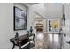Inviting foyer with high ceilings, gray walls, and wood-look floors, leading to dining area at 3930 E Enrose St, Mesa, AZ 85205