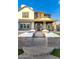 Charming home featuring a welcoming front porch with brick accents and a well-maintained garden at 3930 E Enrose St, Mesa, AZ 85205