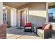 Covered front porch with comfortable seating and a view of the neighborhood at 3930 E Enrose St, Mesa, AZ 85205