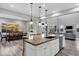 This spacious kitchen features a large island with seating, granite countertops, and stainless steel appliances, perfect for entertaining at 3930 E Enrose St, Mesa, AZ 85205