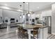 Beautiful kitchen features a large island with seating, granite countertops, stainless steel appliances, and an open concept design at 3930 E Enrose St, Mesa, AZ 85205